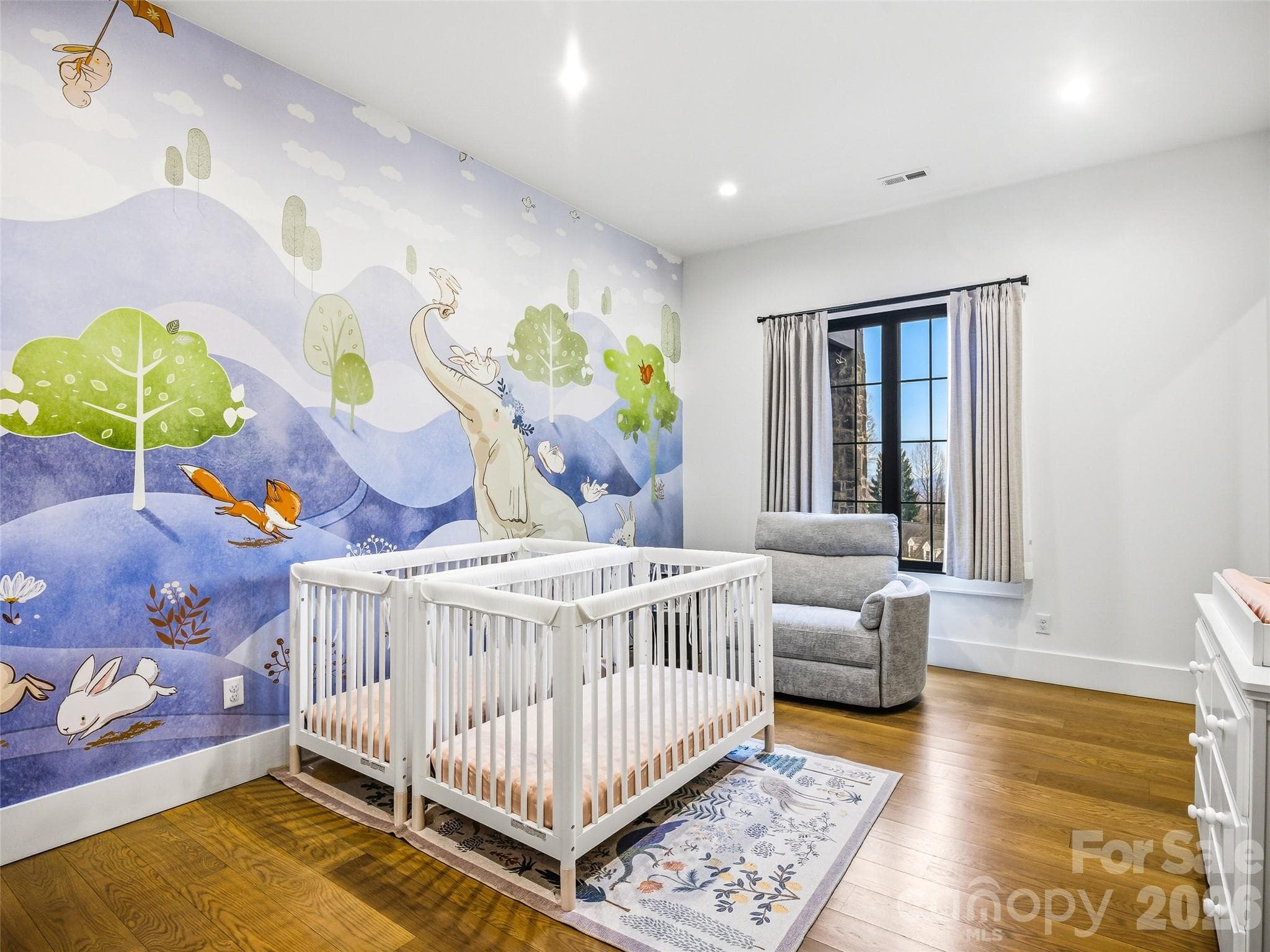 Additional lower-level bedroom with bright windows and clean design - 241 Tower Circle, Hendersonville