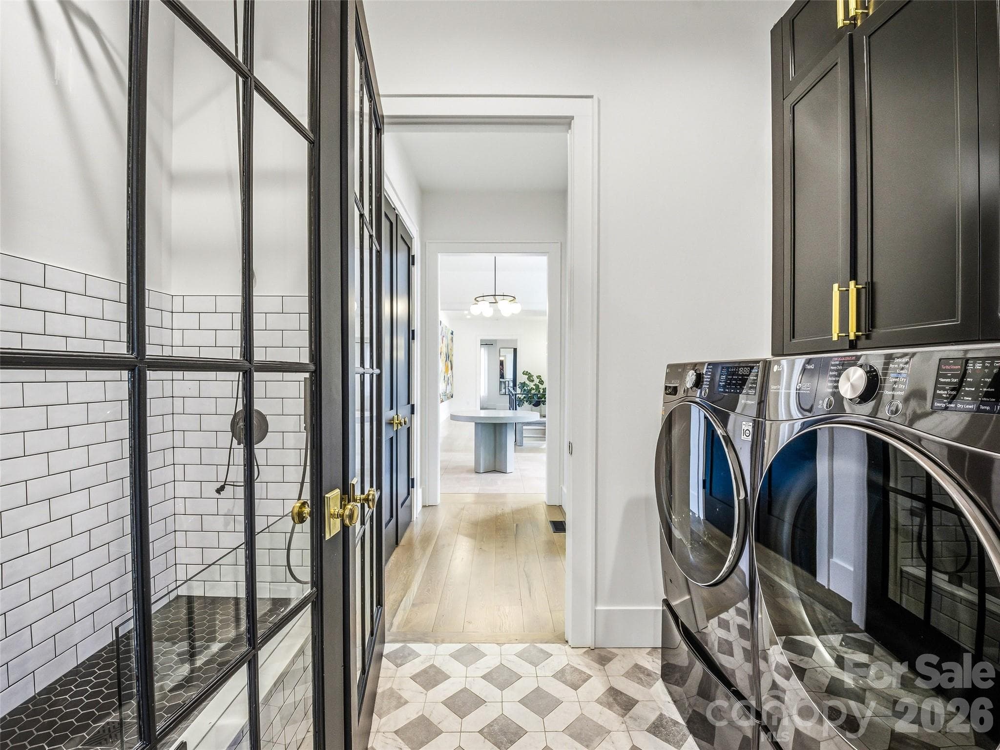 Laundry room with built-in storage and dedicated dog wash station - 241 Tower Circle, Hendersonville