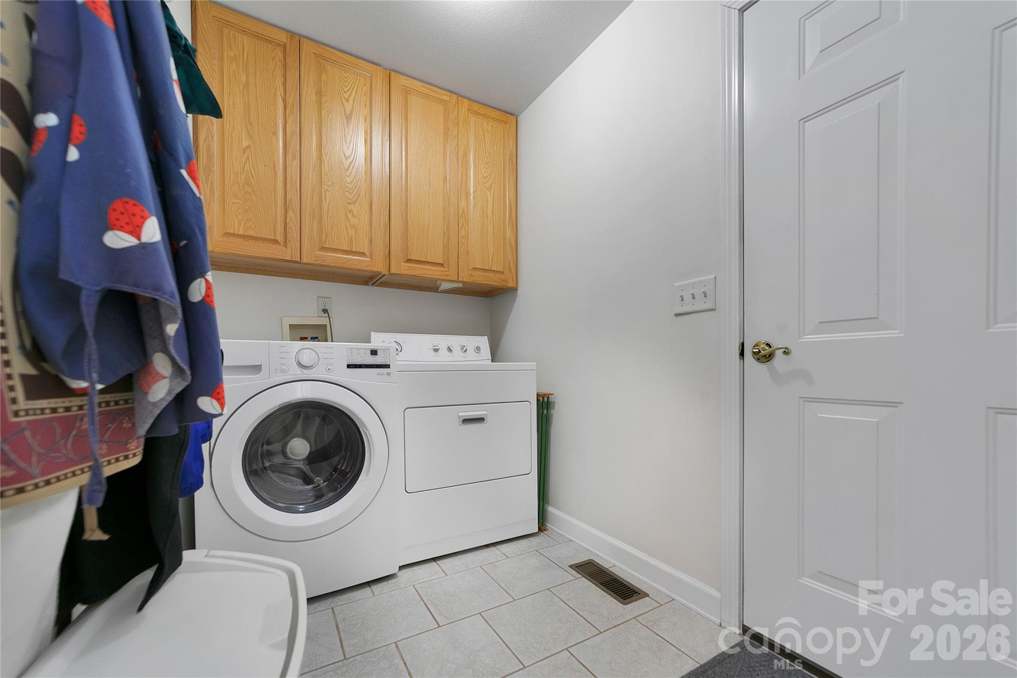 Laundry room with newer cabinets - 126 Gasga Court, Brevard