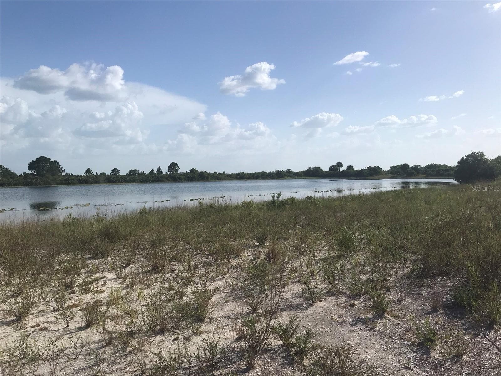 Lake view toward Babcock Ranch Preserve to the West. - 48033 BERMONT RD, PUNTA GORDA