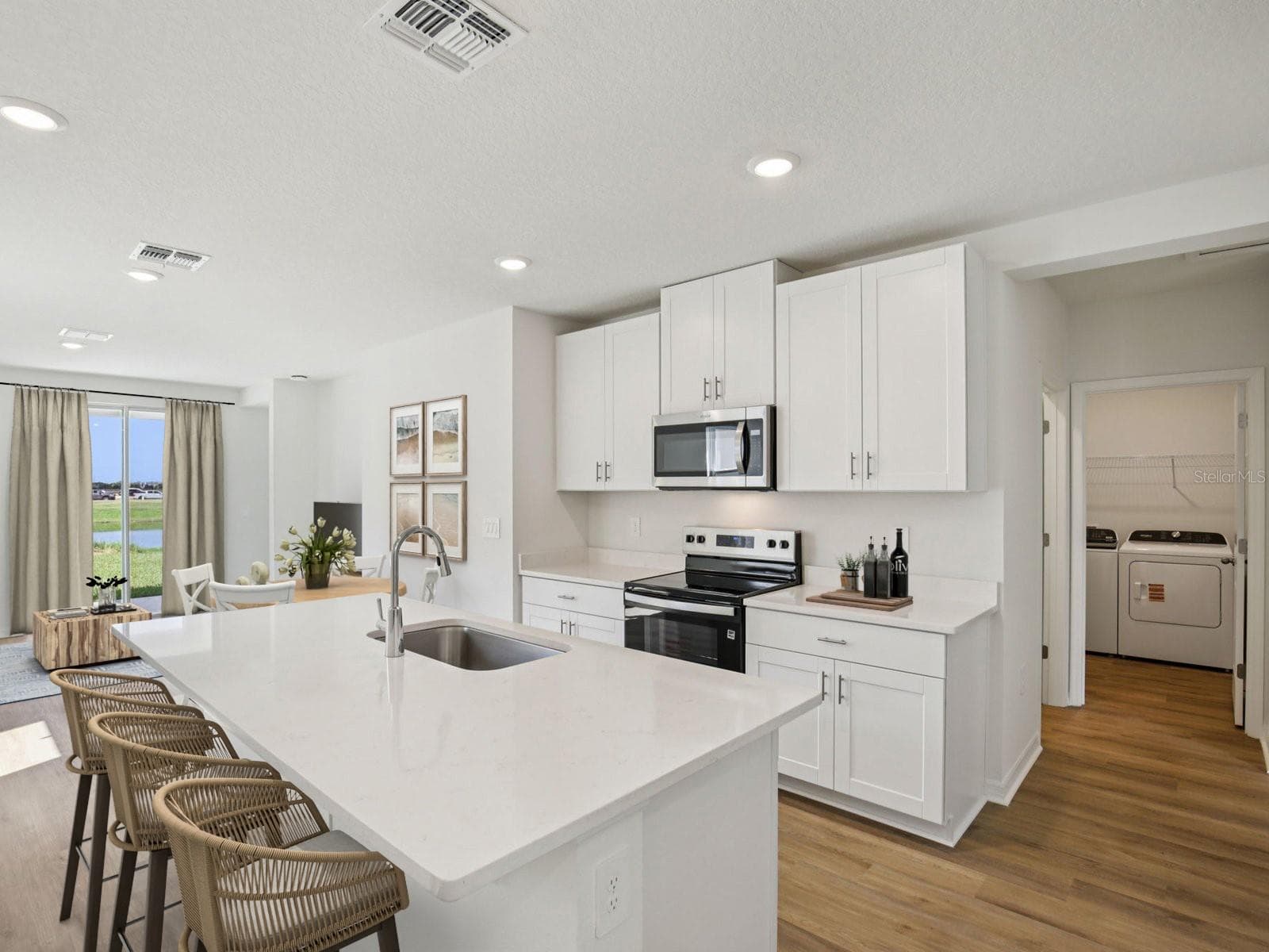 Interior photos are not of the actual home but are photos of the builder home with same floorplan with similar interior finishes and features. Photo uses virtual staging. - 161 CANOE BEND AVE, NOKOMIS