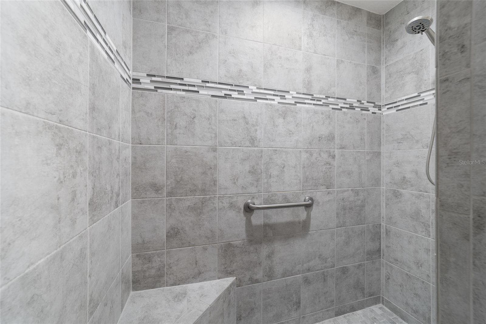 Tiled Roman shower in the primary bath - 1194 MCDONOUGH PL, THE VILLAGES