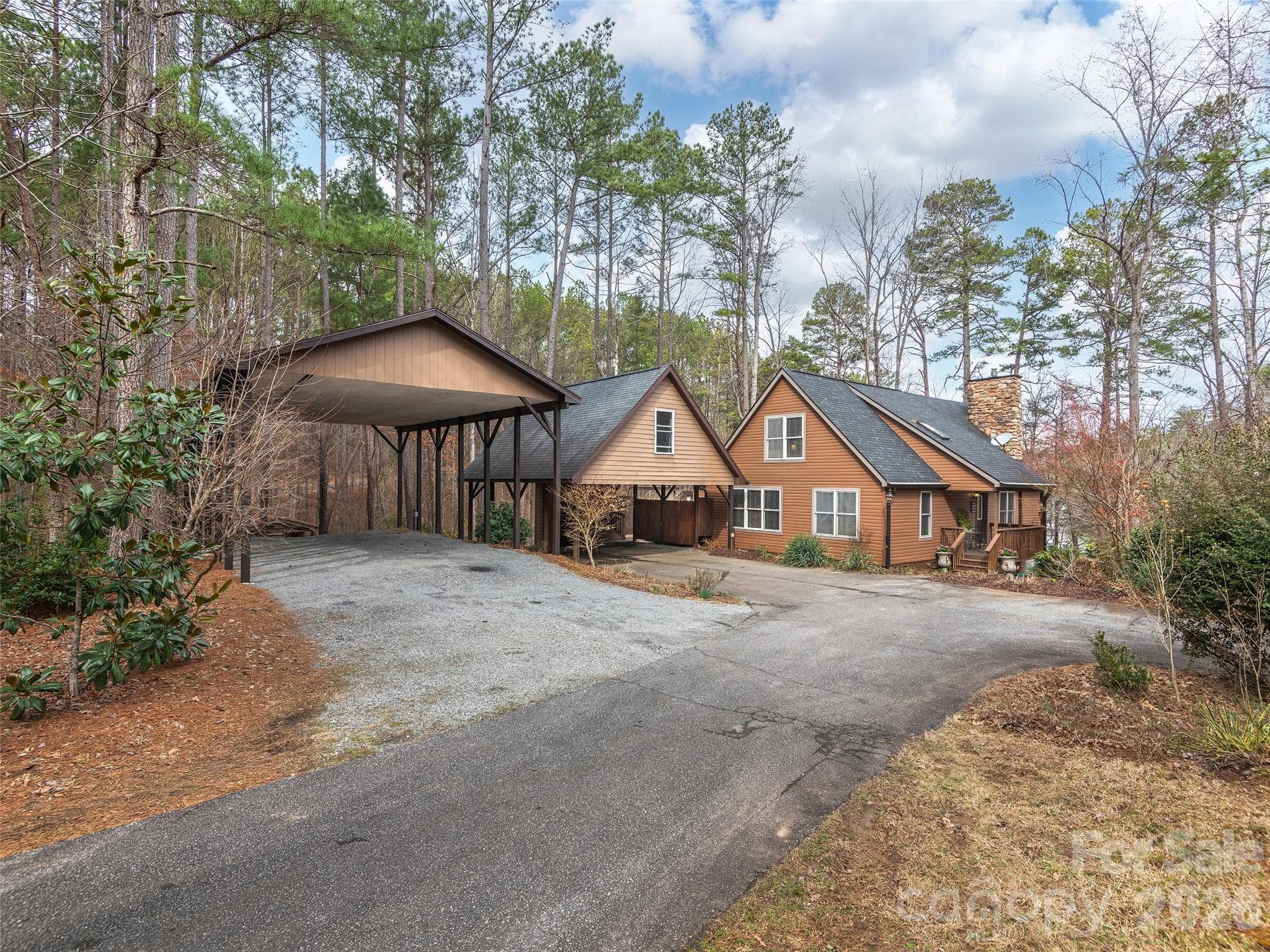 Flat driveway entrance. RV and Carport with hookups. Plenty of parking in the front and... - Mill Spring