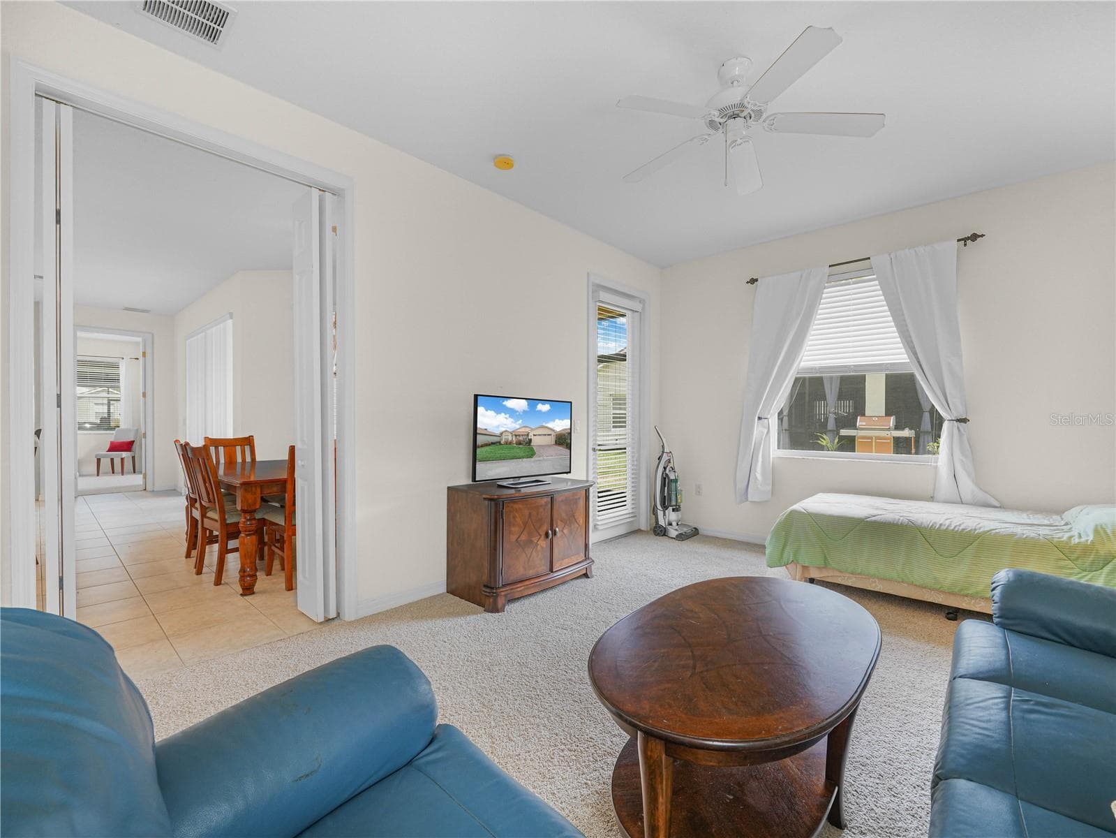 Bedroom 3 with Bi-Fold Doors and Door to Covered/Screened Lanai - 5264 GREEN DR, WINTER HAVEN