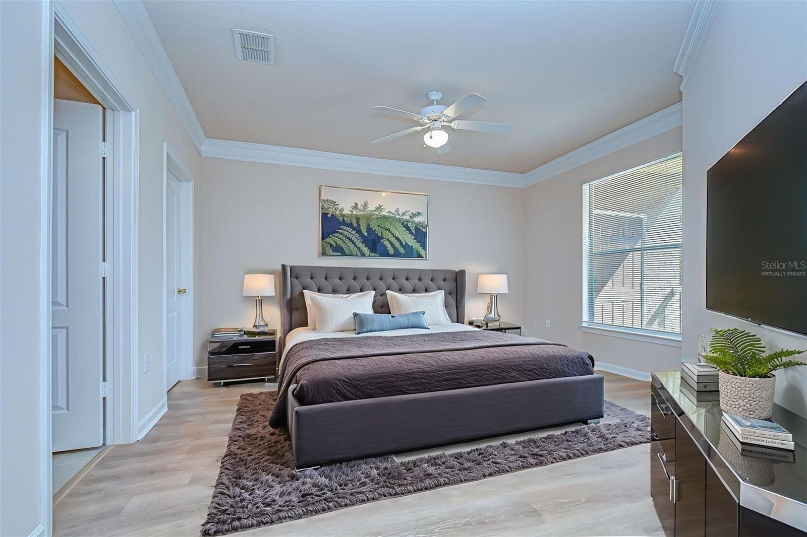 Virtually staged primary bedroom - 10409 VILLA VIEW CIR #10409, TAMPA