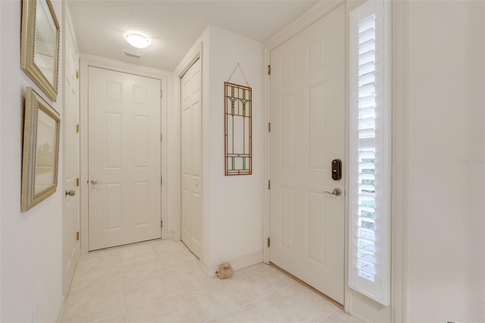 Foyer with access to additional room potential storage or hobby room to the left - 26206 AVENIDA LAS COLINAS #4A, HOWEY IN THE HILLS
