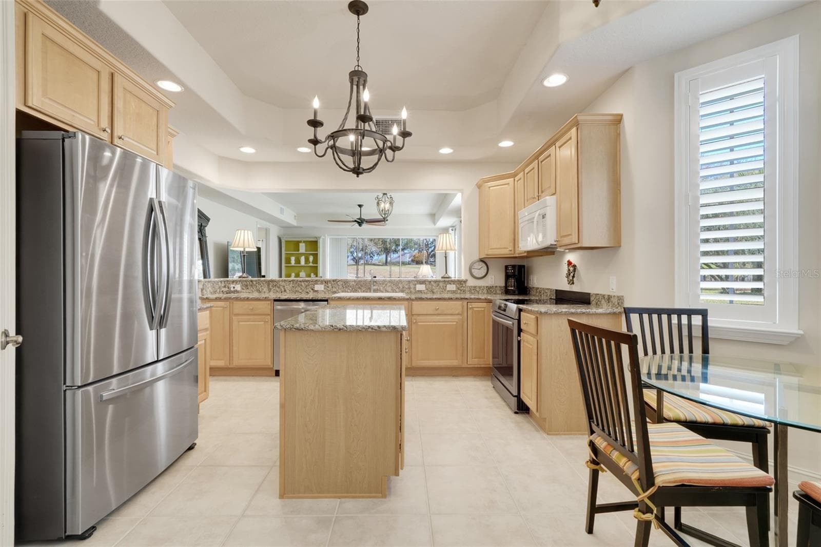 Stainless steel appliances. Island with additional cabinets underneath. - 26206 AVENIDA LAS COLINAS #4A, HOWEY IN THE HILLS