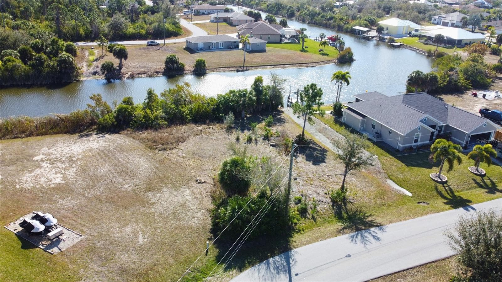 Aerial view of residential area featuring a nearby body of water - 9548 ATTICA CIR, PORT CHARLOTTE
