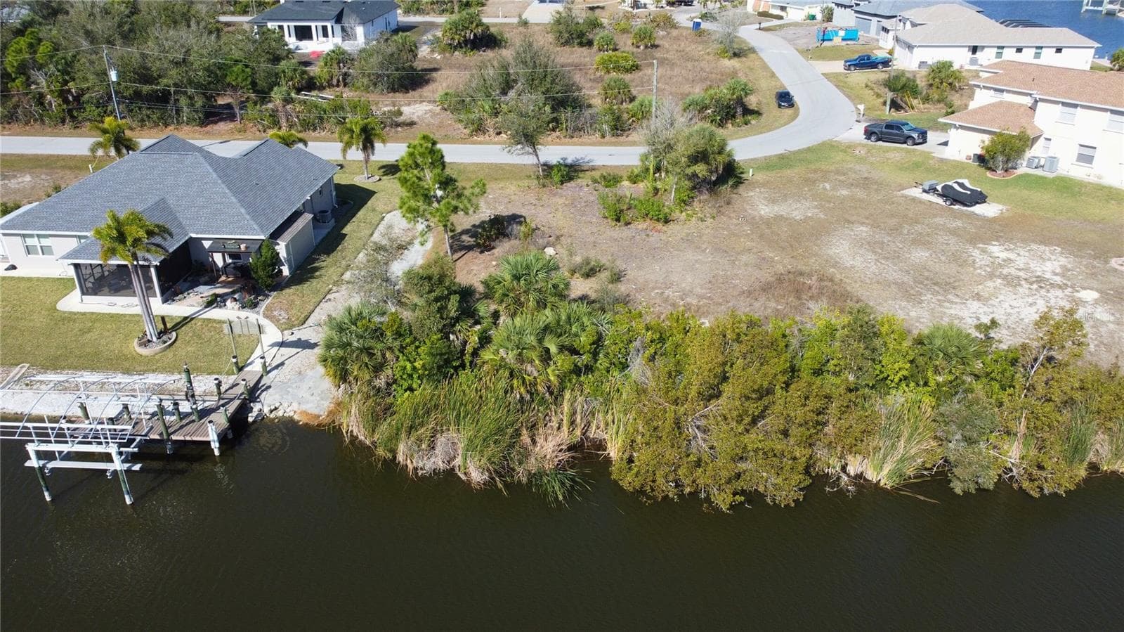 Aerial perspective of suburban area with a large body of water - 9548 ATTICA CIR, PORT CHARLOTTE