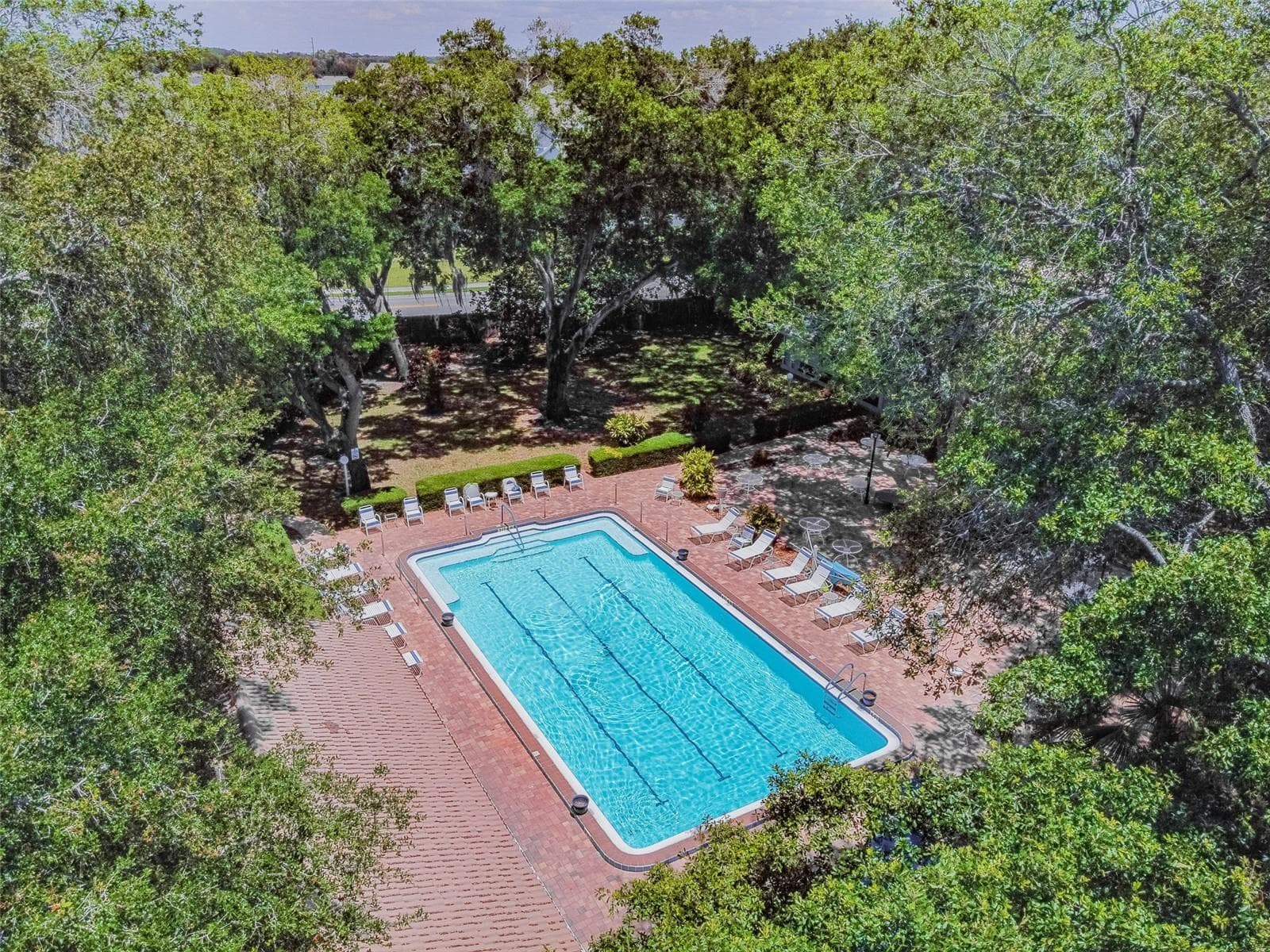 Aerial of the heated pool. - 5611 GARDEN LAKES DR, BRADENTON