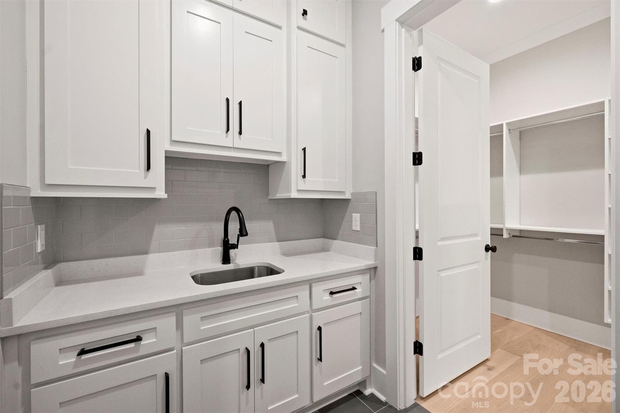 Laundry Room - 1st floor w/tons of storage. Cabinets go to ceiling! - 8163 Fairview Road, Charlotte