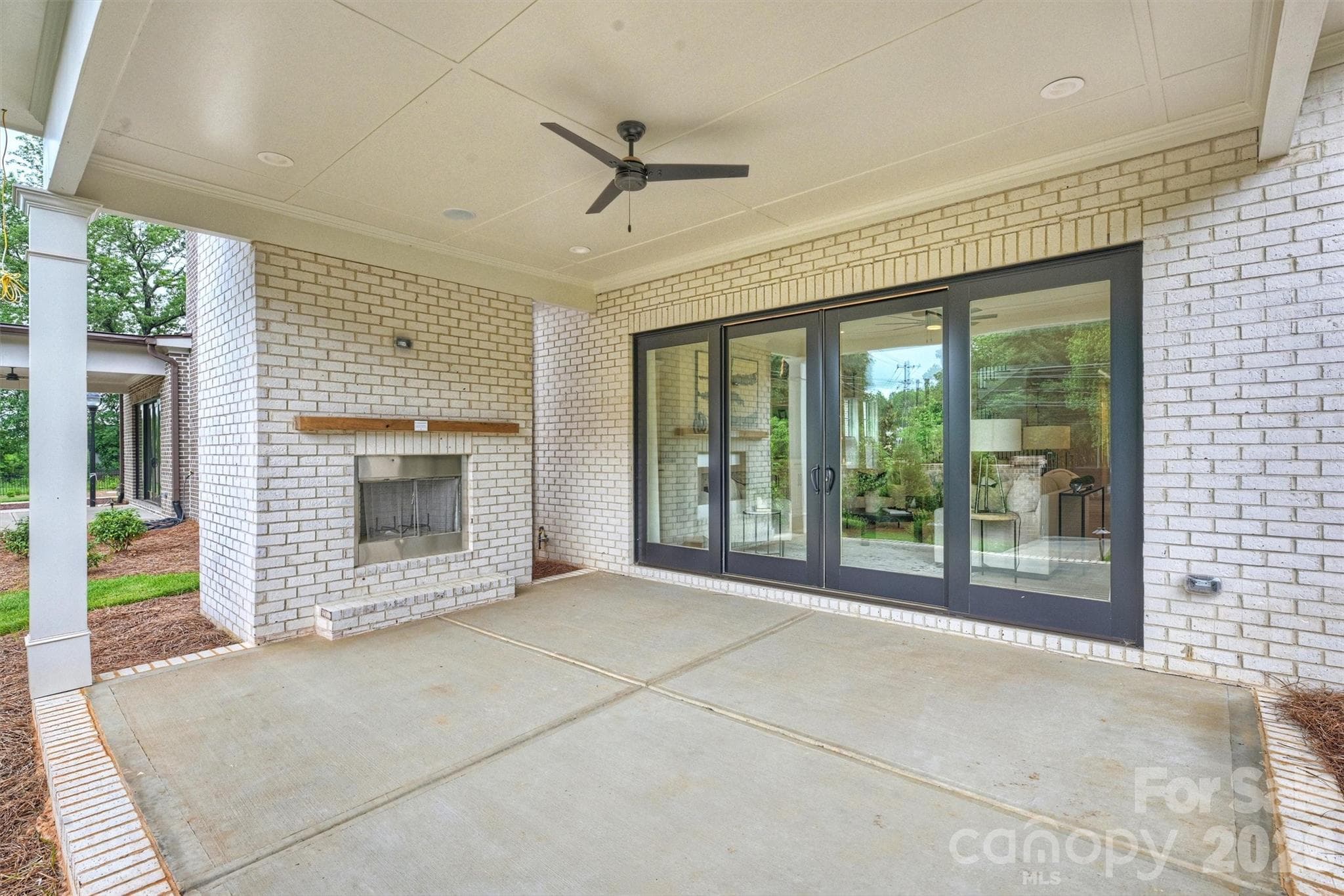 Covered porch w/wood burning fireplace & wired for sound - 8163 Fairview Road, Charlotte