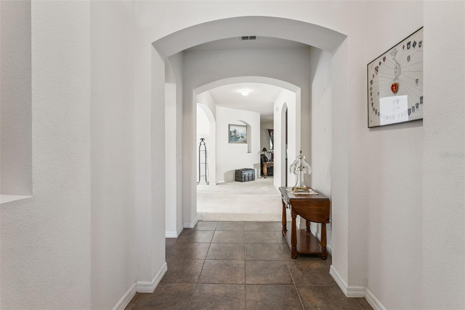 Hallway connecting primary living areas and bedrooms - 30337 GIDRAN TER, MOUNT DORA
