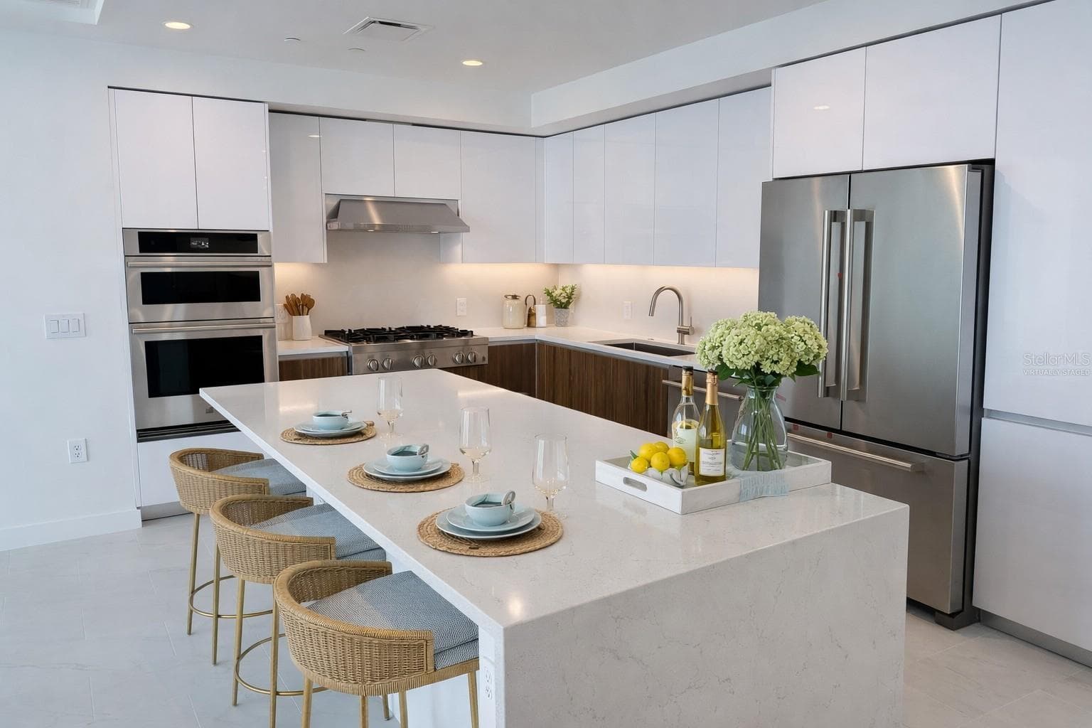 Waterfall Quartz Island / Breakfast Bar / Kitchen with Stainless Steel Jenn Air Appliances - Virtually Staged - 400 CENTRAL AVE #2603, ST PETERSBURG