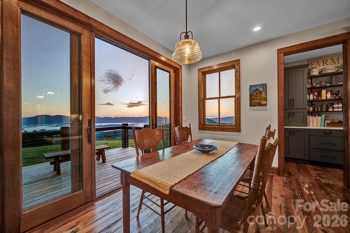 Wide sliding glass doors in dining area and great room - 217 Sunrise Vista Lane, Banner Elk