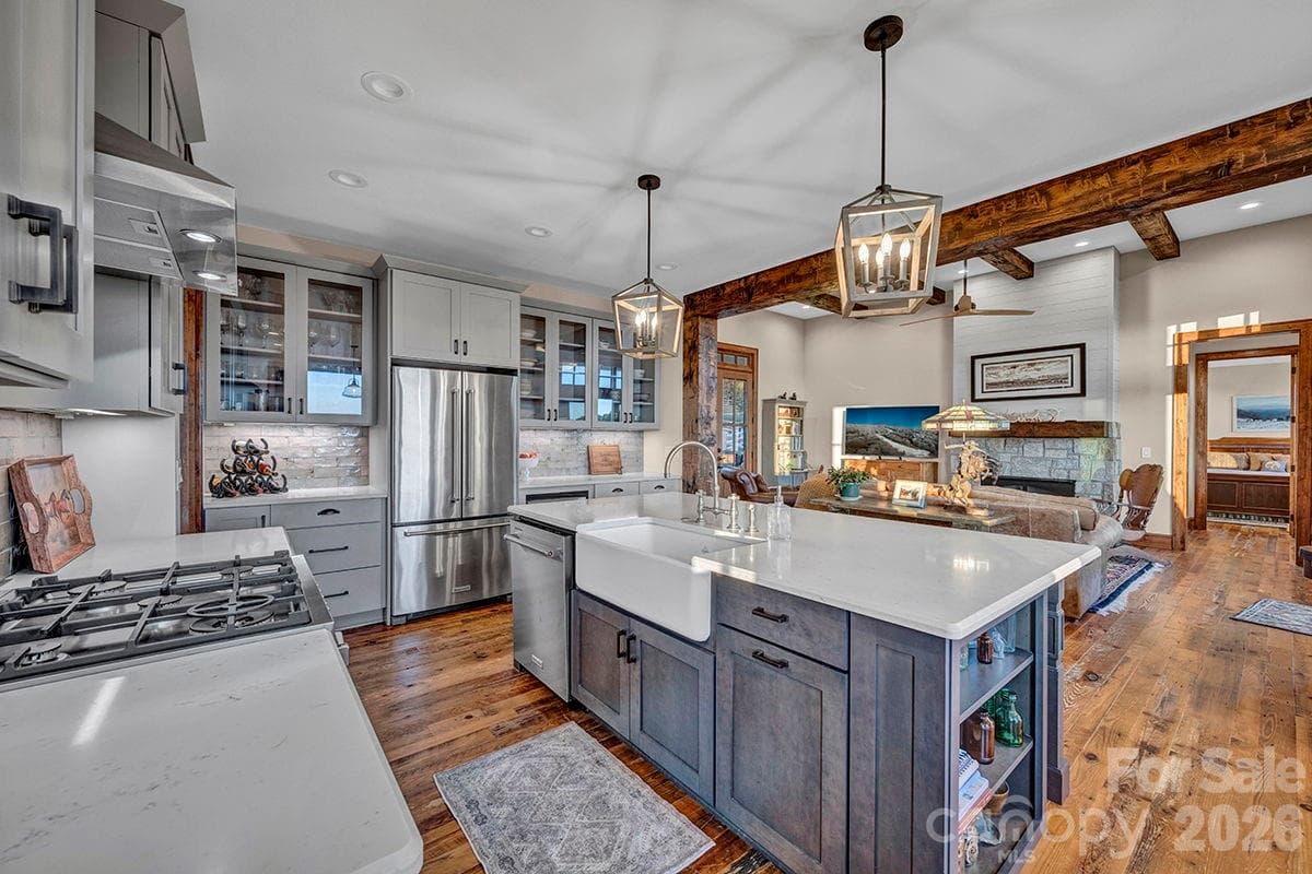 Farm house sink, custom cabinets, Bertazzoni gas range w/exhaust hood and upgraded pendant lighting - 217 Sunrise Vista Lane, Banner Elk