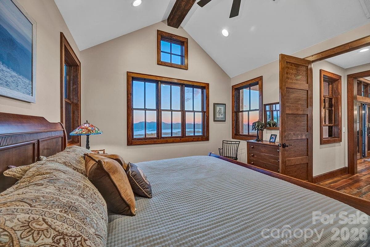 Cathedral ceiling accented with wood beam and ceiling fan - 217 Sunrise Vista Lane, Banner Elk