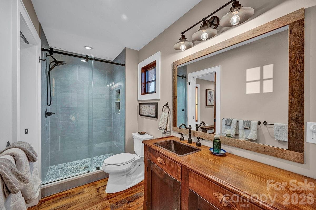 Vintage furniture vanity in guest bedroom bathroom - 217 Sunrise Vista Lane, Banner Elk