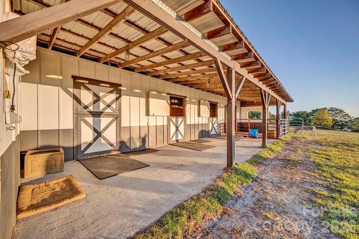 4 stalls open to overhang, opposite side of barn has 12'x24' equipment storage - 217 Sunrise Vista Lane, Banner Elk