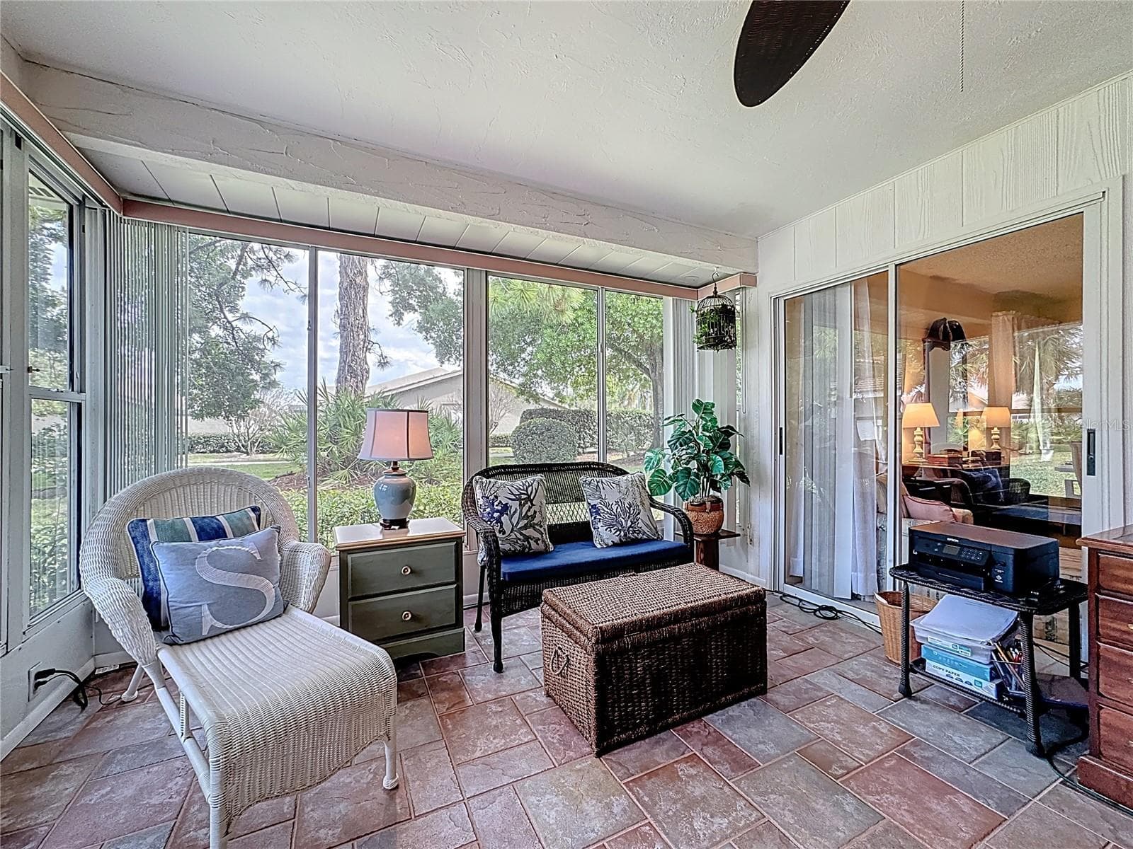 Florida room and sliding door to the primary suite offer lots of natural lighting. - 5611 GARDEN LAKES DR, BRADENTON