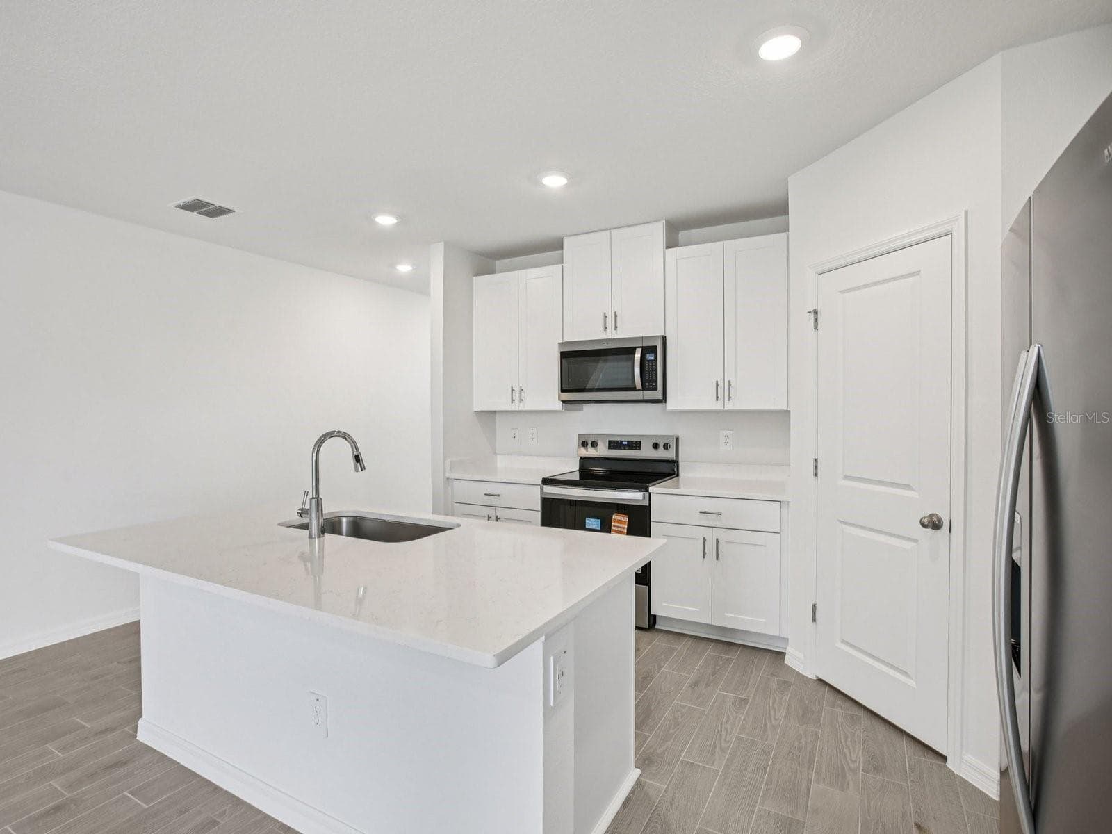 Interior photos are not of the actual home but are photos of the builder home with the same floorplan with similar interior finishes and features. - 7214 RAY CREEK DR, BROOKSVILLE
