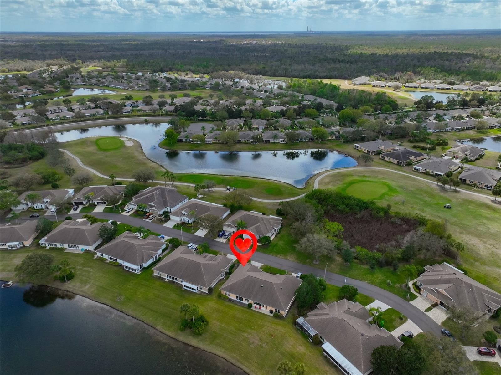 WHAT A GREAT LOCATION! WATER VIEW IN THE REAR AND WOODS IN THE FRONT. NO ACROSS THE STREET NEIGHBOR. - 2308 BROOKFIELD GREENS CIR, SUN CITY CENTER
