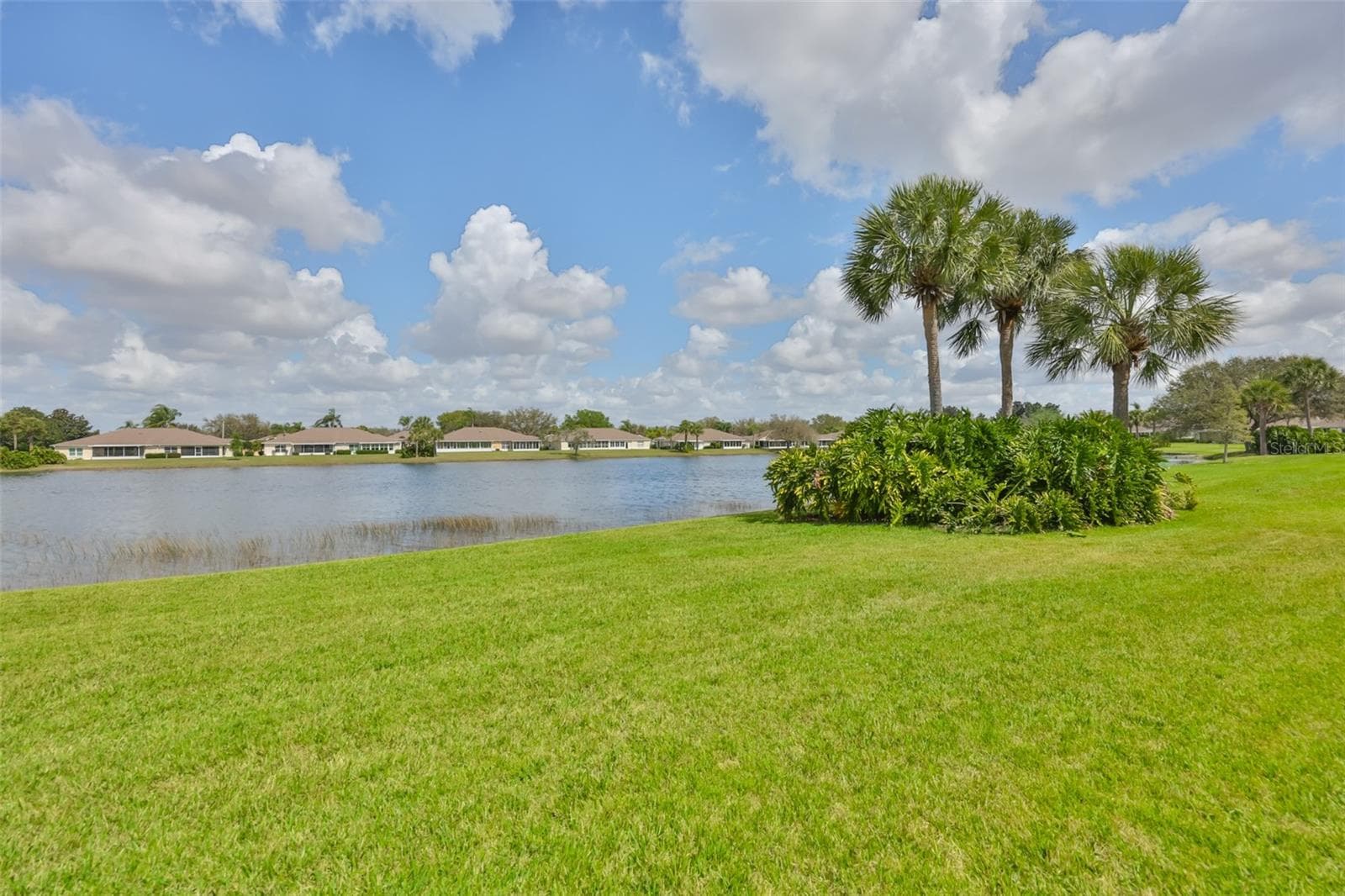DEEP YARD WITH WONDERFUL WATER VIEW - 2308 BROOKFIELD GREENS CIR, SUN CITY CENTER