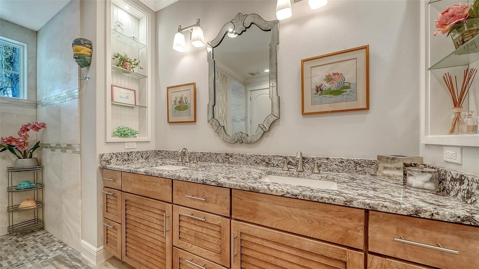 Built-in shelving allows you to display art pieces, photographs, colognes, and perfumes, with plentry of storage to tuck away your other toiletries. - 1794 CUNLIFF LN, SARASOTA