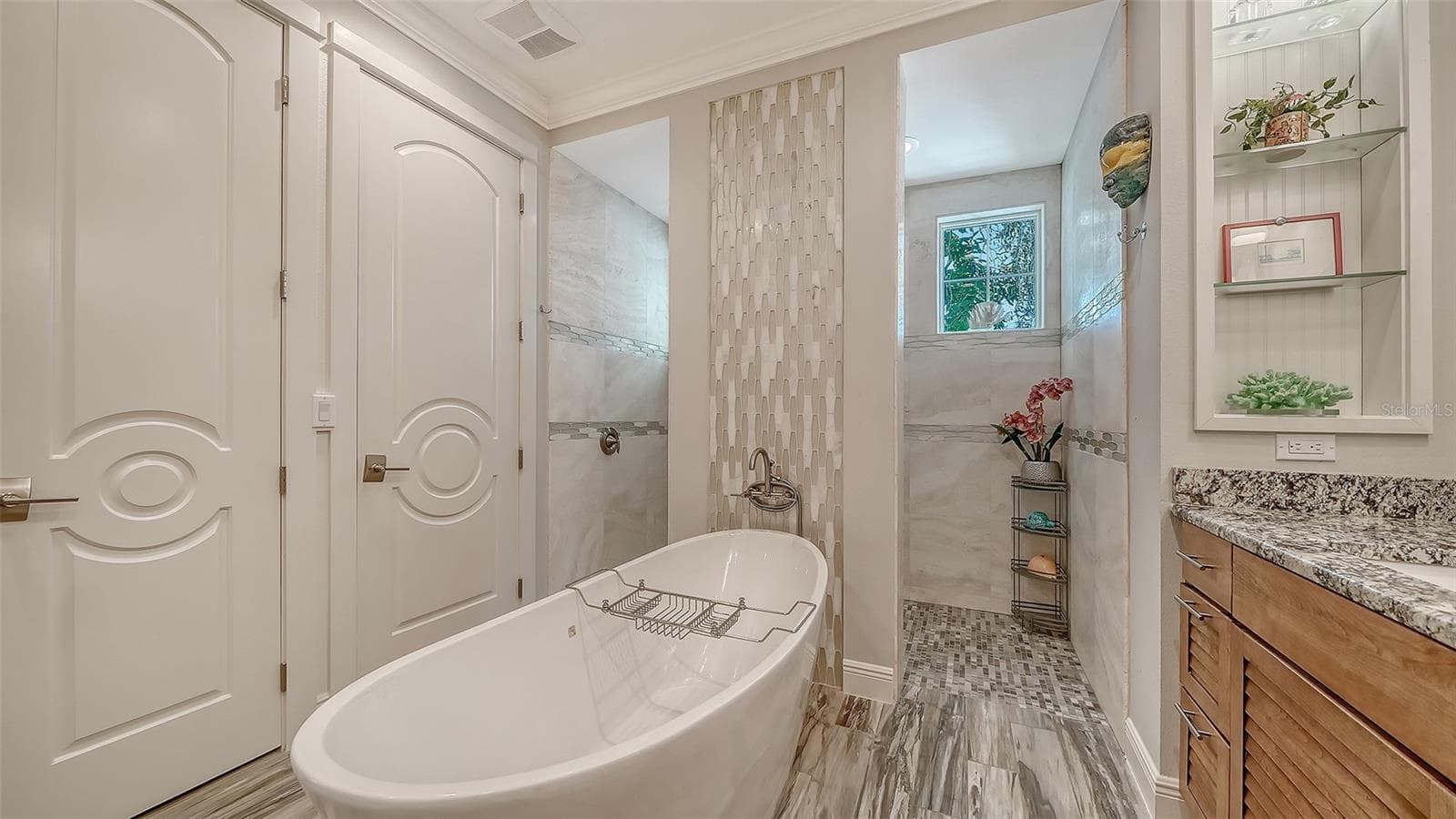 The primary suite offers natural lighting, a private lavatory, and linen closet - 1794 CUNLIFF LN, SARASOTA