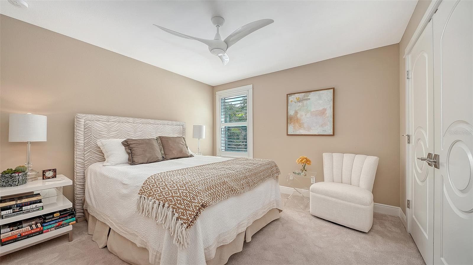 Bedroom four is carpeted, with a large closet featuring custom built-ins in each corner of the closet - 1794 CUNLIFF LN, SARASOTA