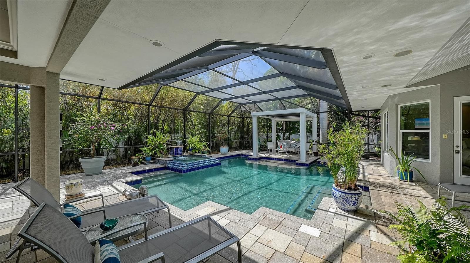 The heated pool is only one of the delights of this tiled, screened-in pool deck - 1794 CUNLIFF LN, SARASOTA