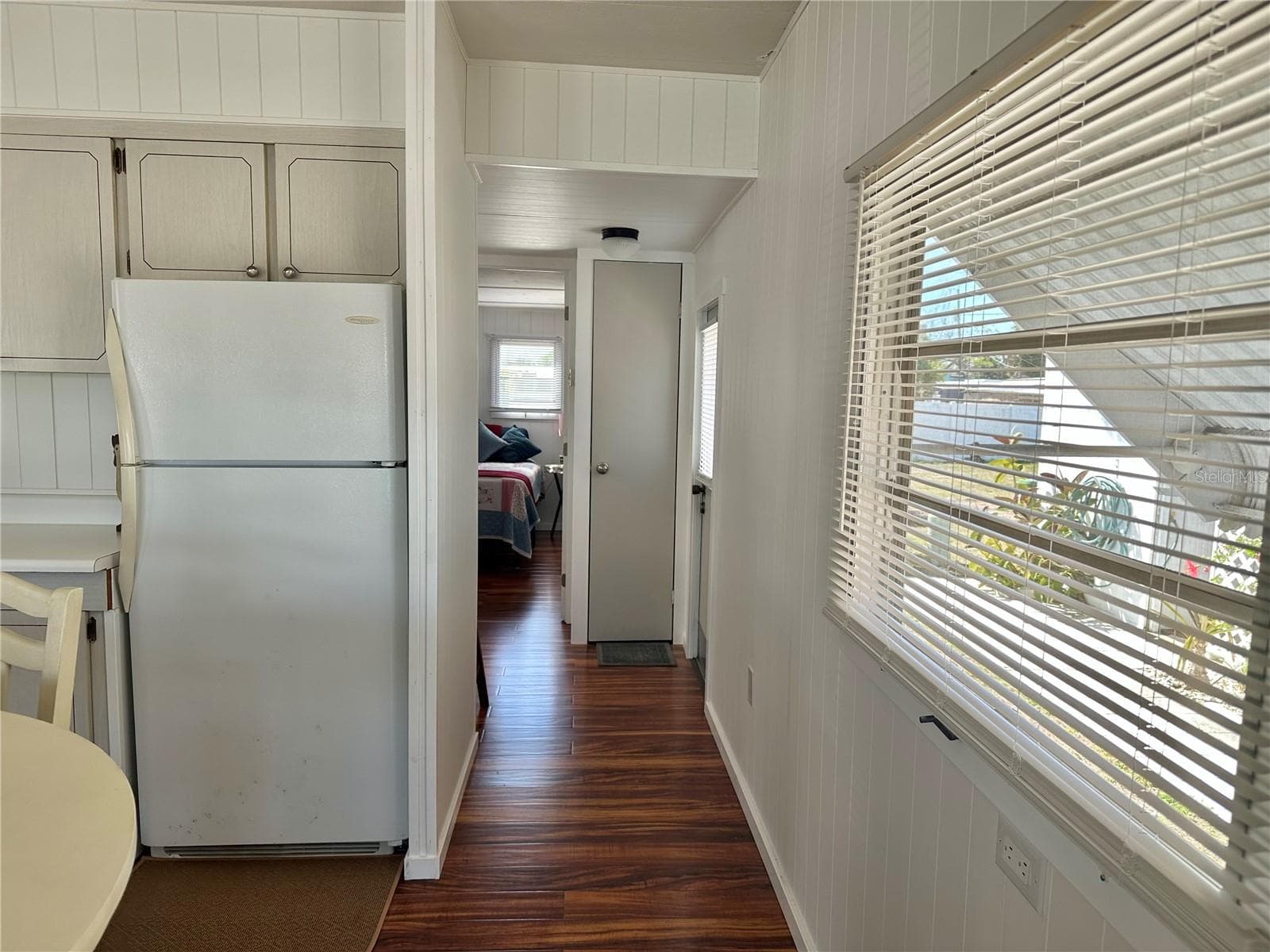 view of back door, hall closet and entrance to bedroom - 1501 25TH AVENUE DR W, BRADENTON