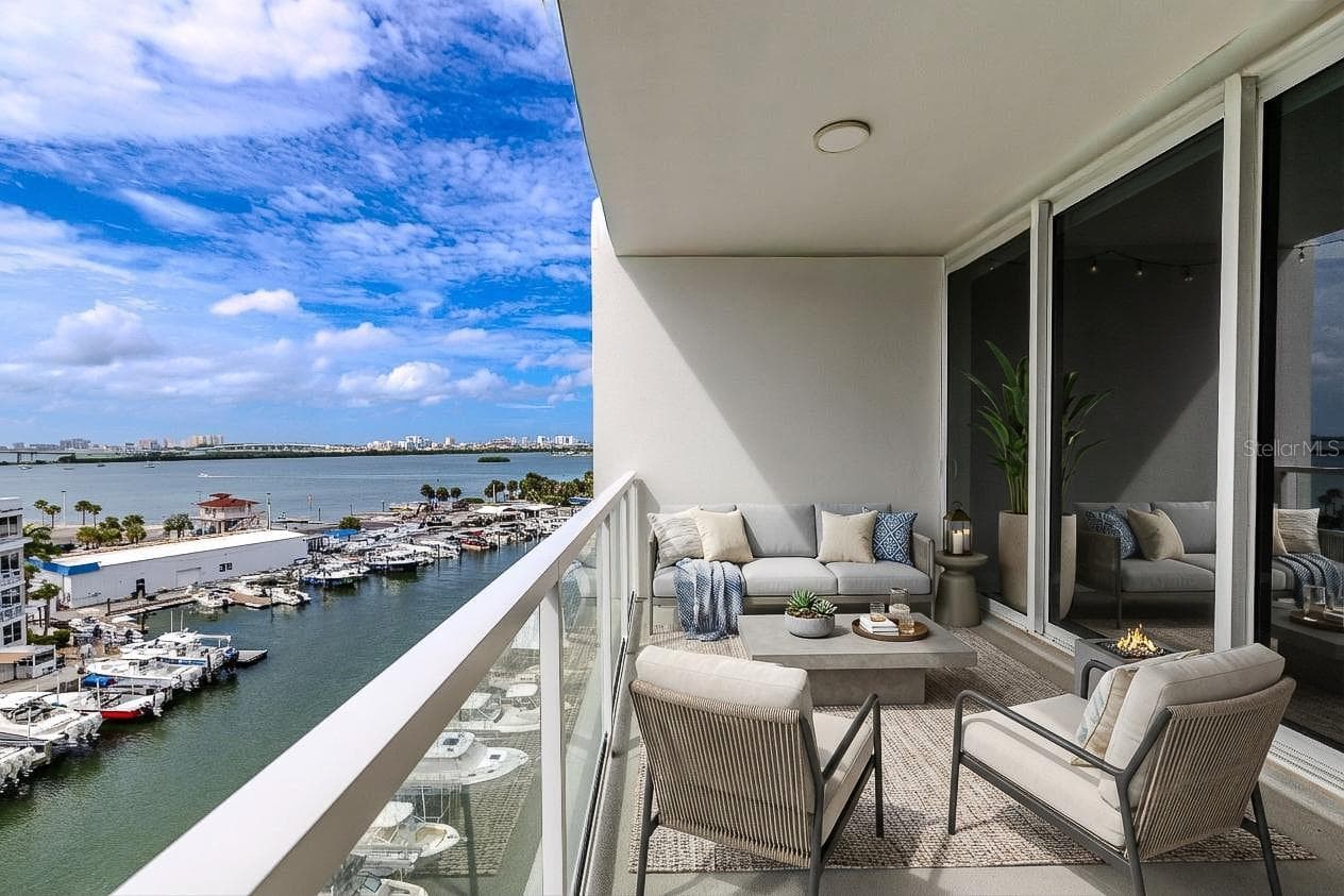 From your private balcony, take in the sights of passing boats, lush waterfront residences, and the stunning skyline beyond—all while basking in the warm Gulf breeze. - 920 N OSCEOLA AVE #703, CLEARWATER
