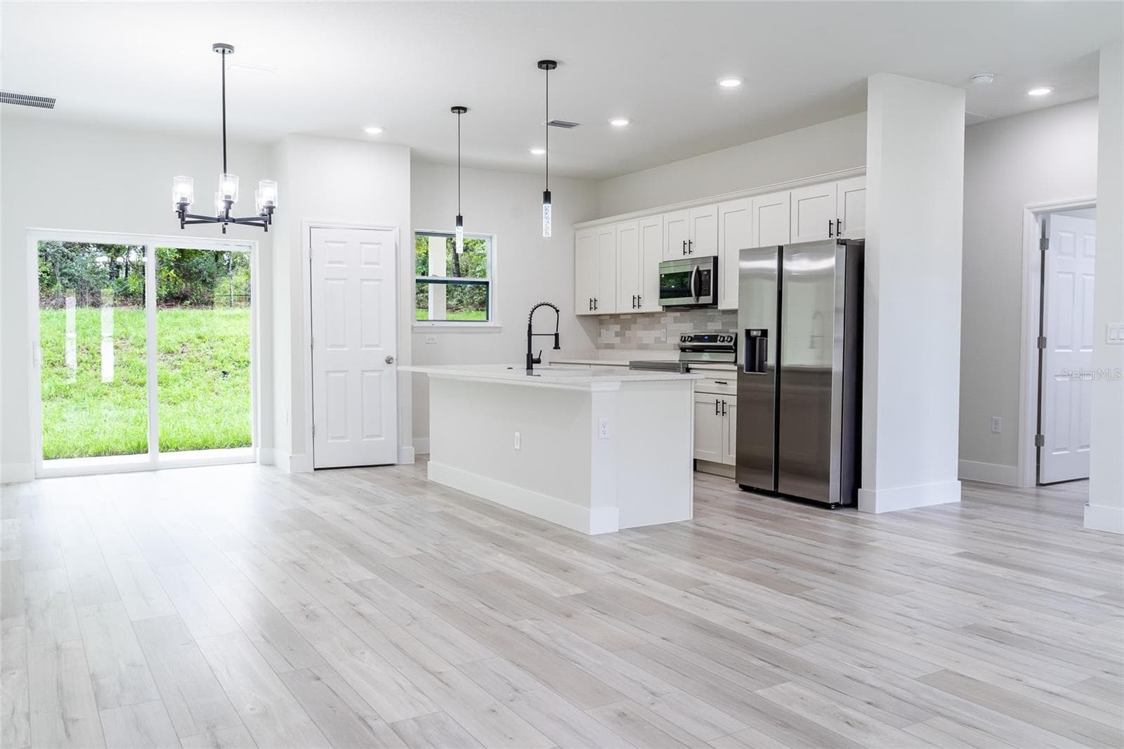 Kitchen and dining area from front entry - 7872 N KEYSTONE DR, CITRUS SPRINGS