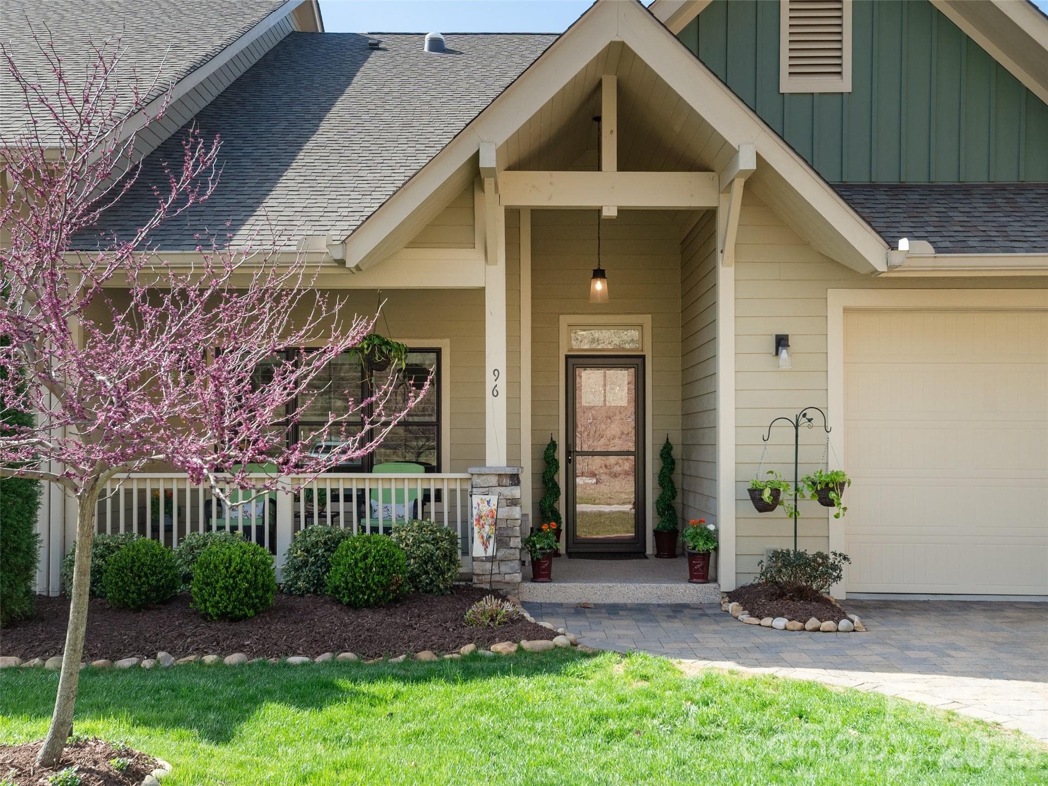 A beautiful end-unit entryway instantly sets a welcoming tone, offering added privacy and natural light that enhances the home’s appeal. - Hendersonville