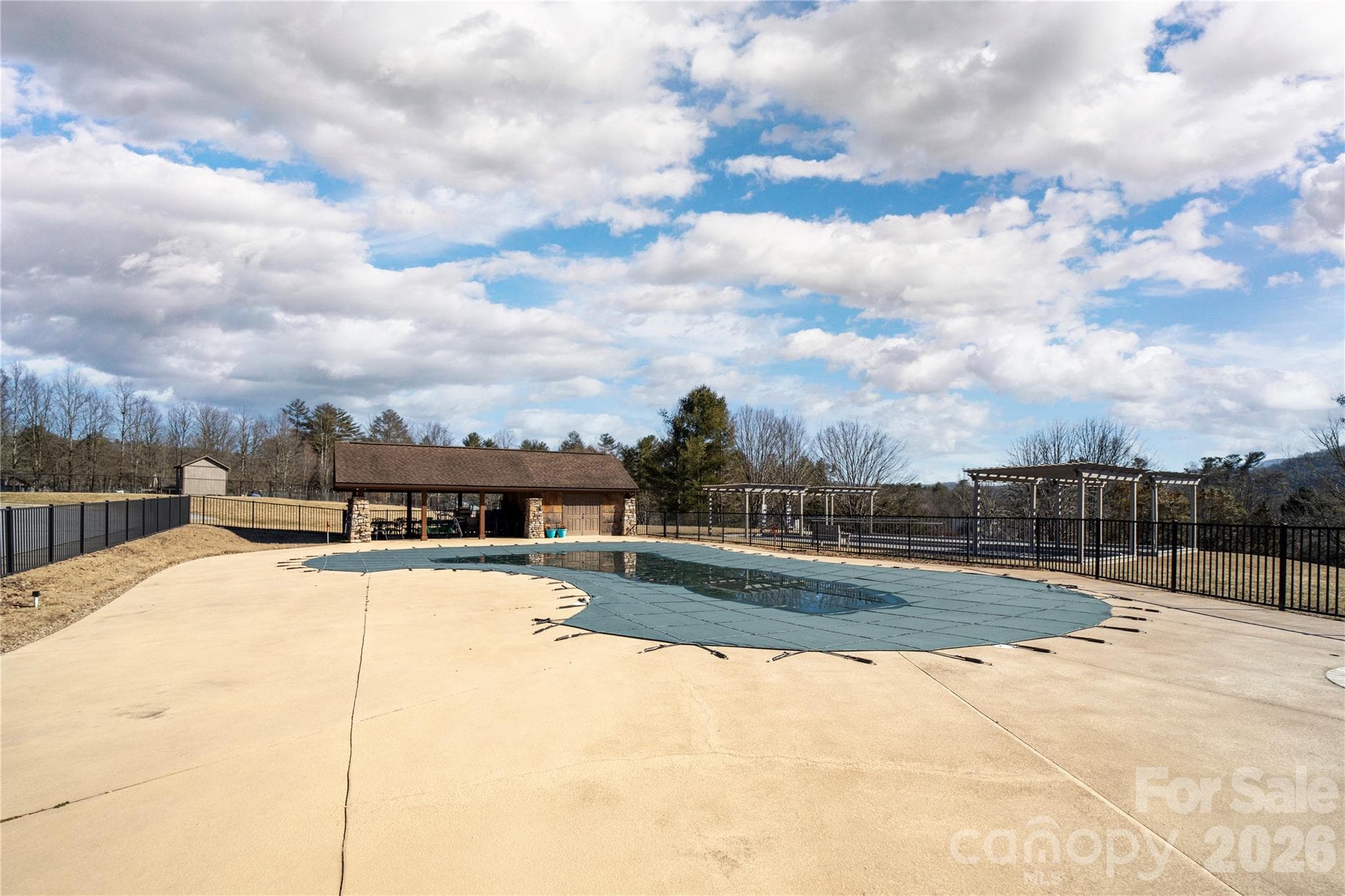 Swimming Pool area with hot tub and covered out eating space. - Hendersonville