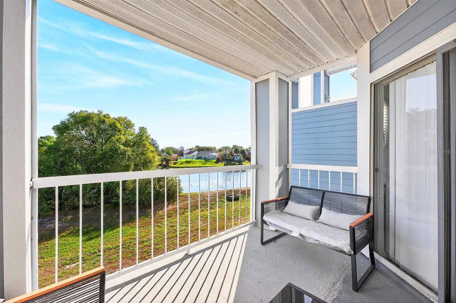 Balcony has water views. - 2569 GRASSY POINT DR #207, LAKE MARY