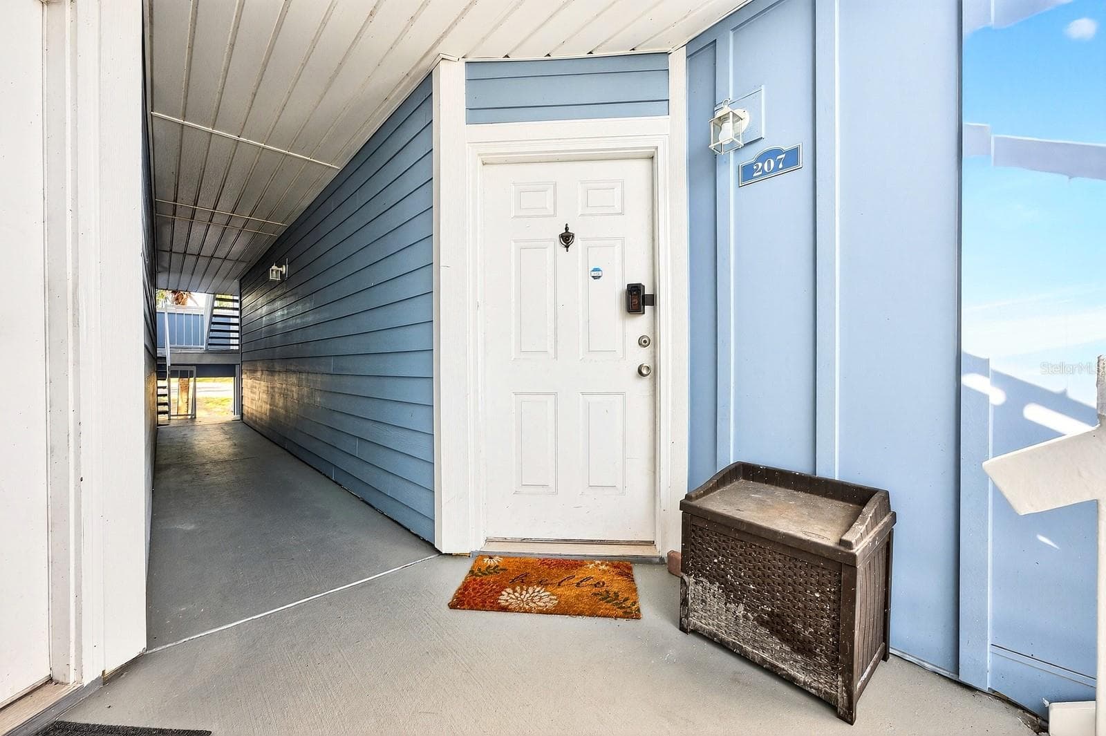 Covered front entry. - 2569 GRASSY POINT DR #207, LAKE MARY