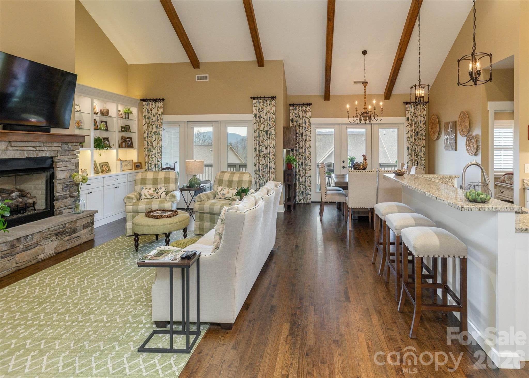An open-concept living space combined with a gas fireplace offers the perfect balance of airy spaciousness and intimate warmth. - Hendersonville