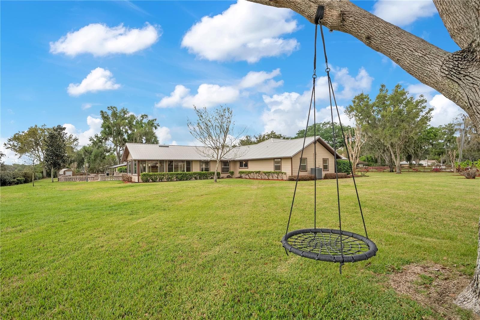 Swing in backyard - 1401 BUELL CT, PLANT CITY