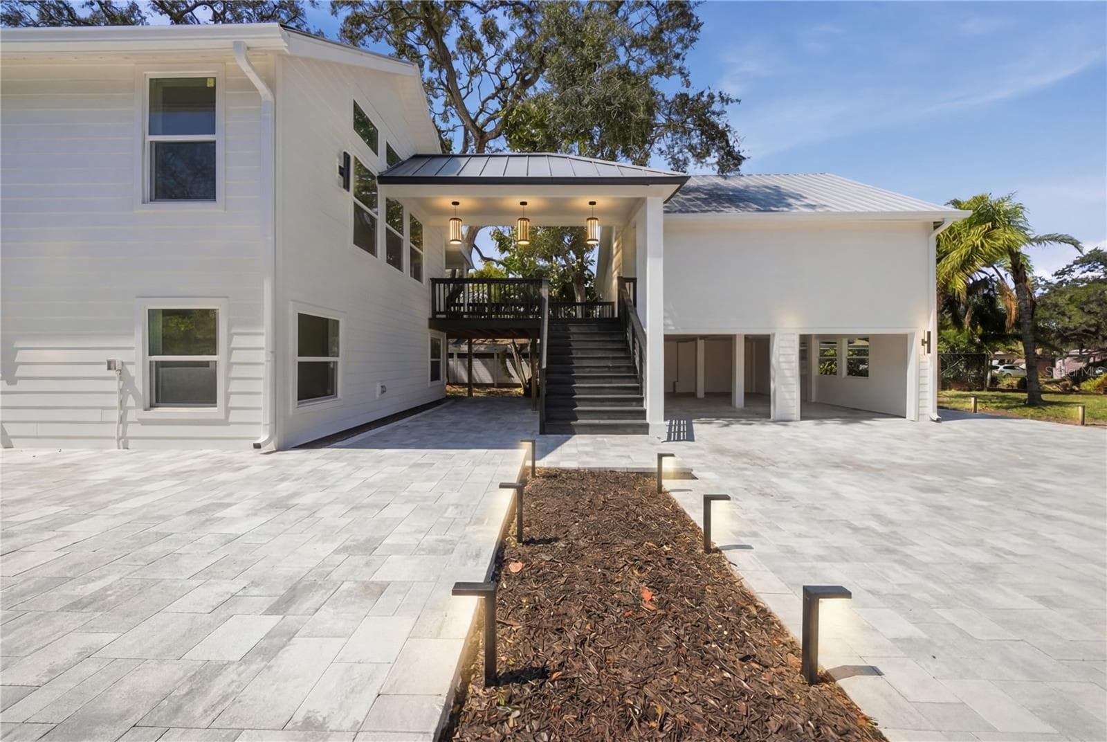 Staged with covered walkway between buildings. - 1109 CHARLES ST, CLEARWATER