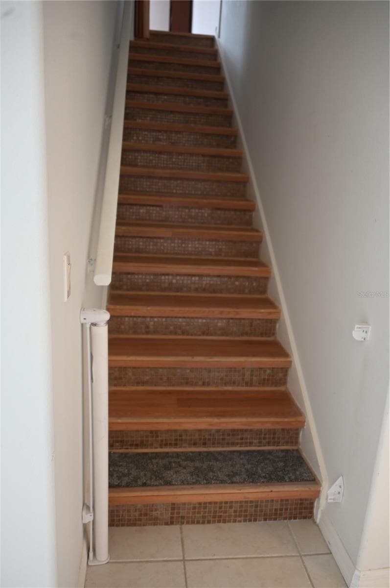 Stairs to the upper private bonus room - 8800 OAK LANDINGS CT, ORLANDO