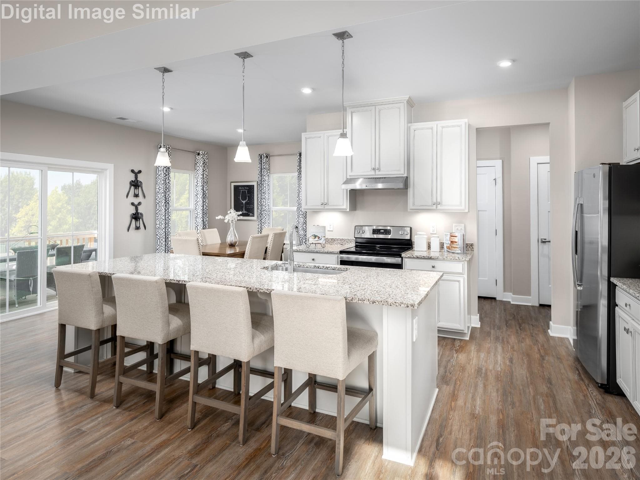 Open and inviting — seating for four at the island makes this kitchen perfect for casual meals and conversation. - Charlotte