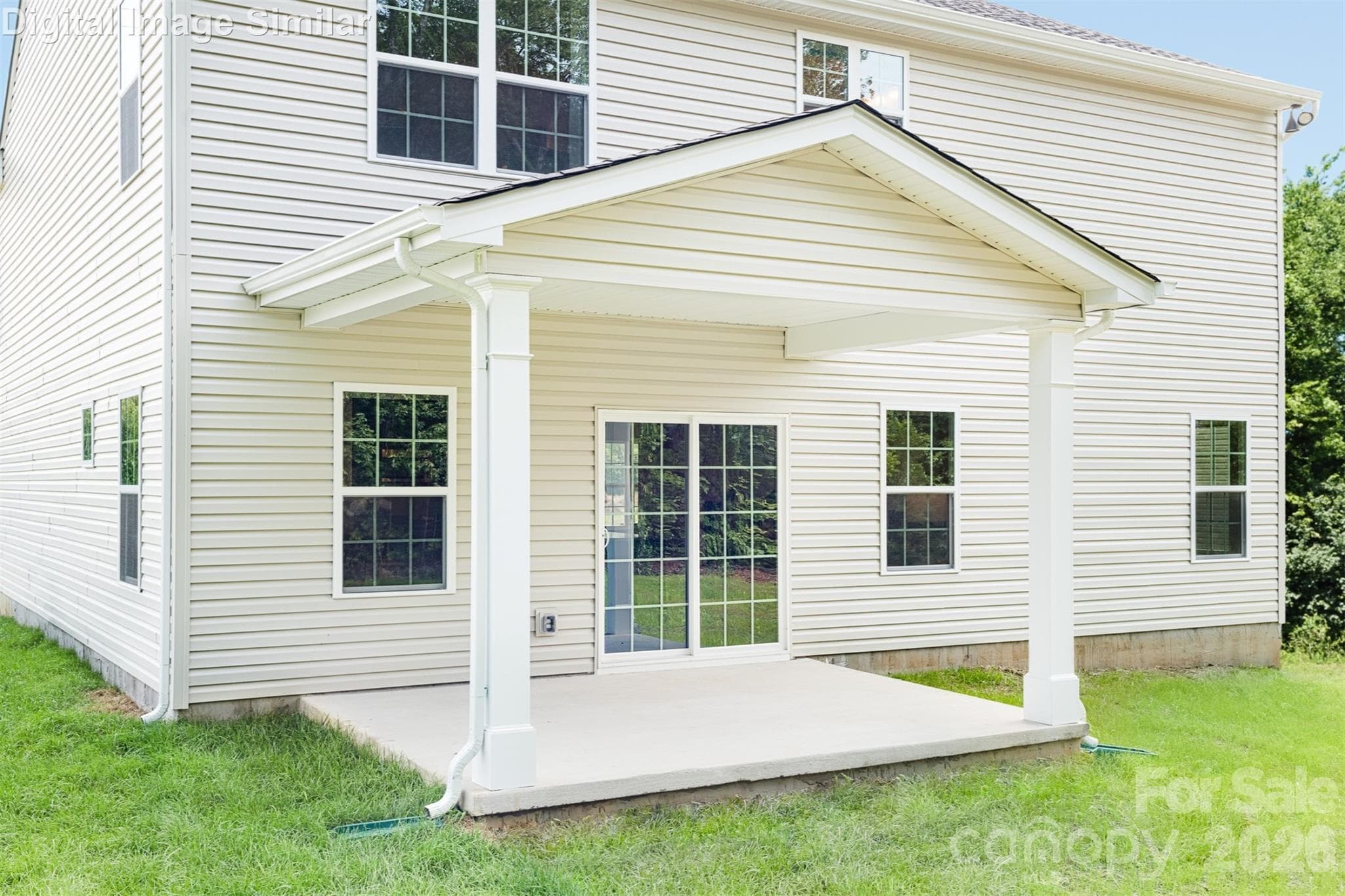 Optional covered porch — more room to relax and enjoy get-togethers while the kids play out back. - Charlotte