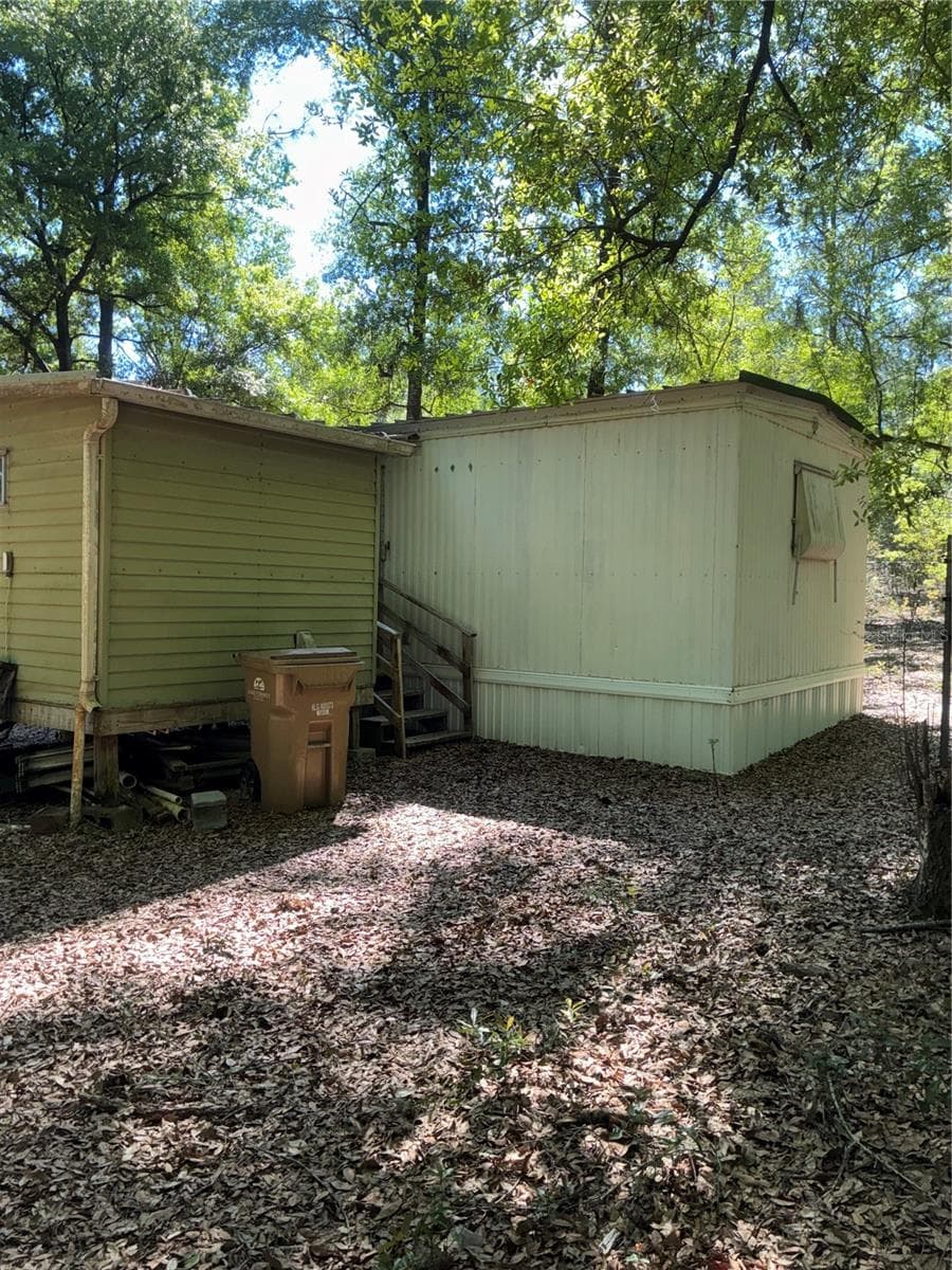 View of storage shed from the opposite side of the yard. - 24533 PINK PANTHER RD, PAISLEY