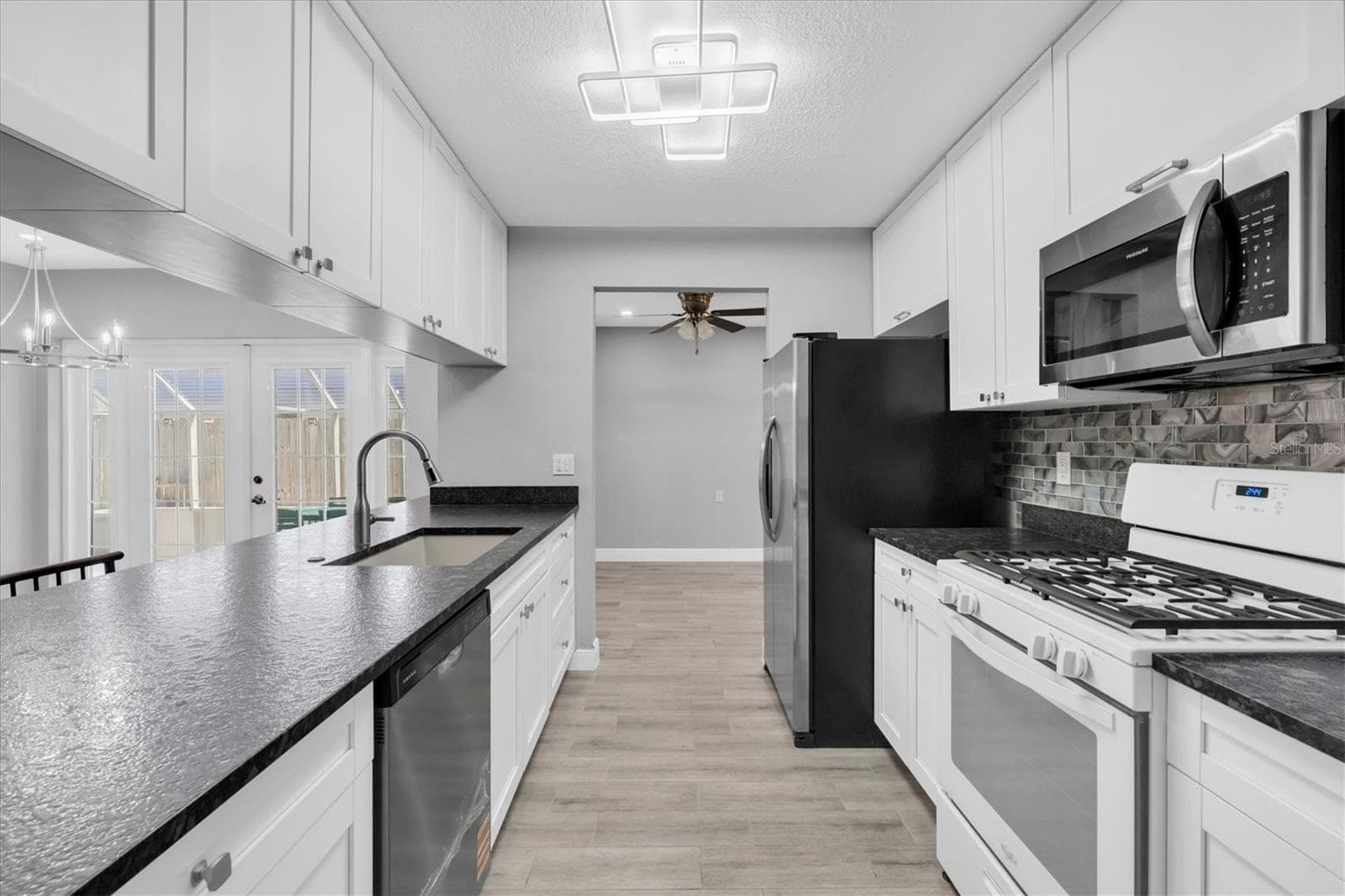 Nice and bright. Lots of counter and cabinet space - 5619 DENVER ST NE, ST PETERSBURG