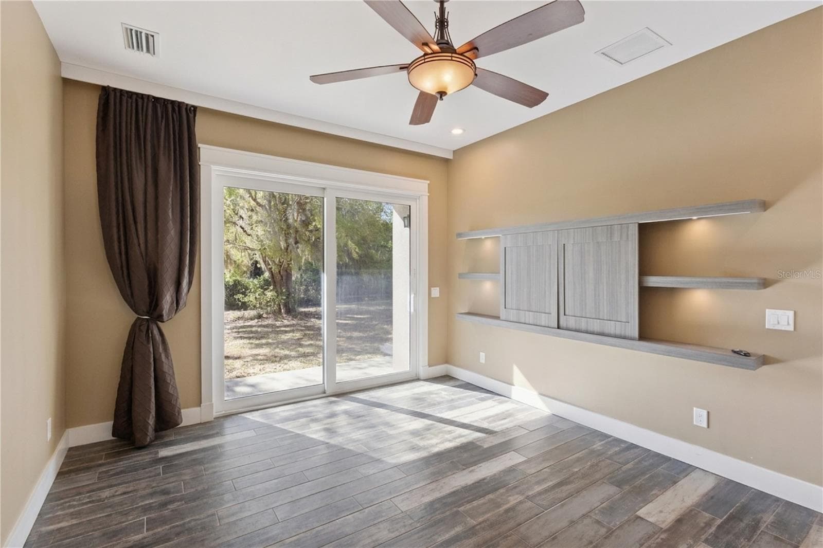 Master Bedroom with custom built in for TV - 15503 TROTTING HORSE LN, TAVARES