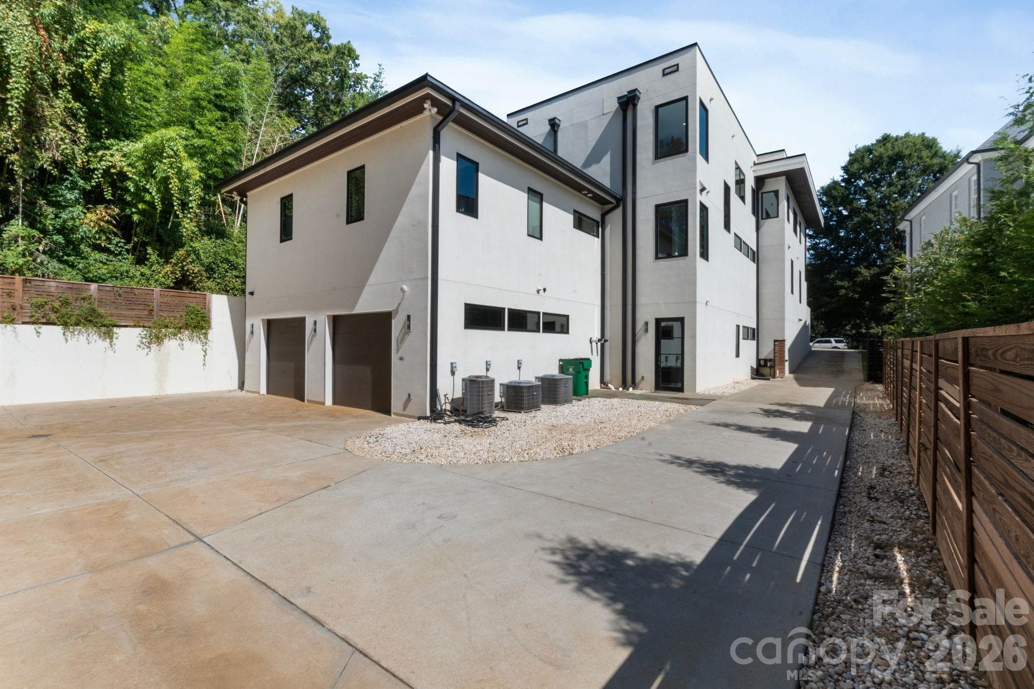 Attached 2 car garage view from back of house. - Charlotte