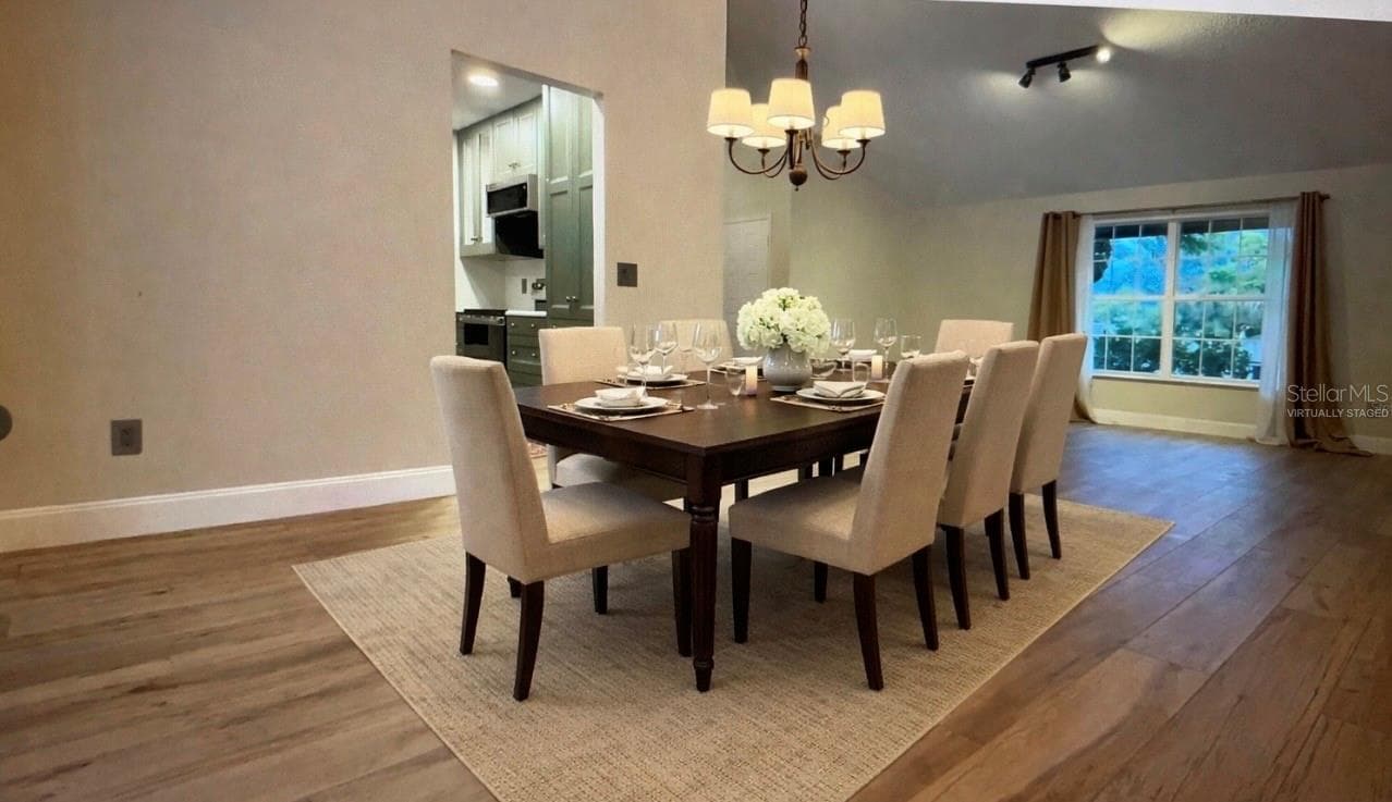 FORMAL DINING ROOM: VIRTUALLY STAGED PHOTO - 9115 BAY SIDE CT, ORLANDO