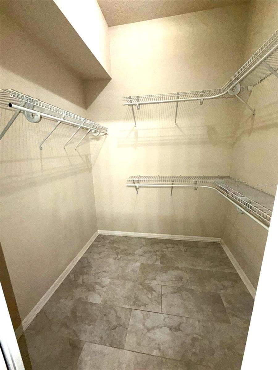 Walk in Closet. AI Enhanced - 6002 RENAISSANCE CT, ST CLOUD
